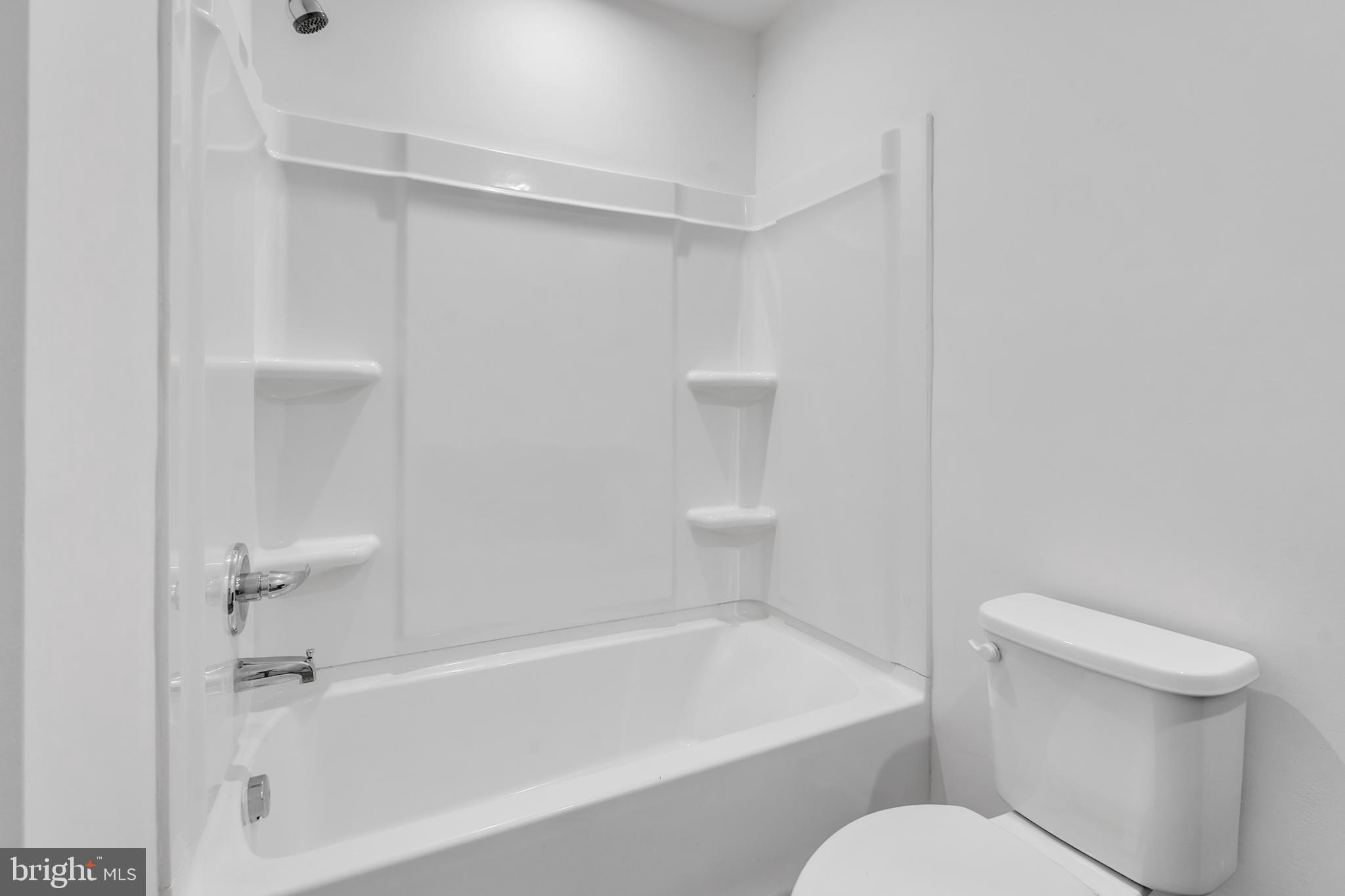 144 Ciseley Drive Sicklerville, NJ 08081 - Photo 31 of 48 a white toilet sitting next to a bath tub