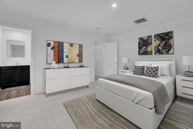 144 Ciseley Drive Sicklerville, NJ 08081 - Photo 44 of 48 a bedroom with a bed and a fireplace