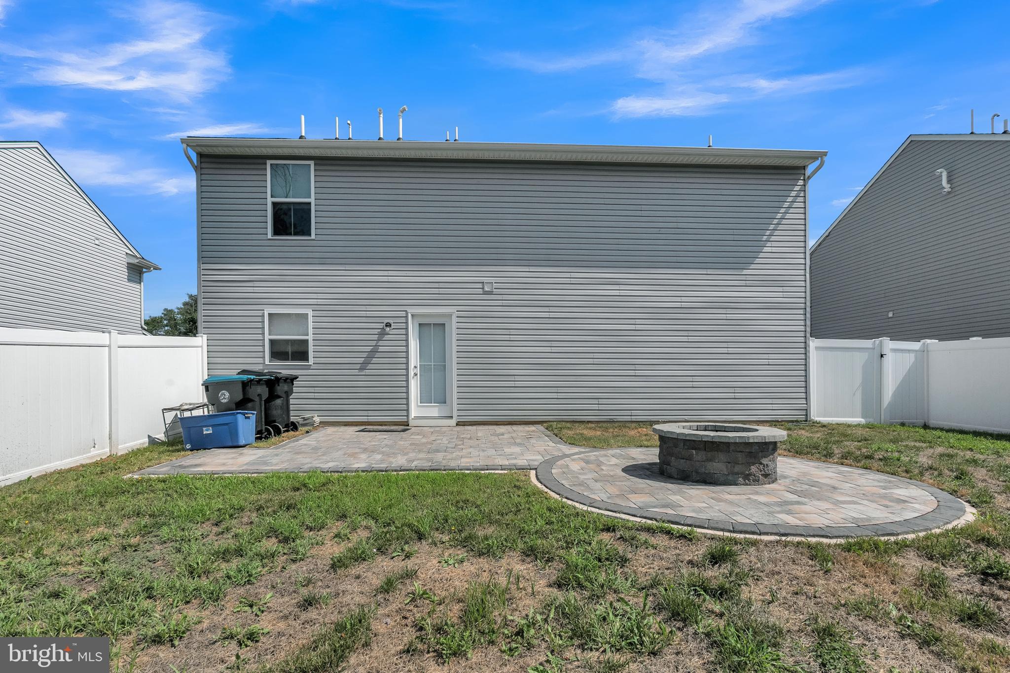 144 Ciseley Drive Sicklerville, NJ 08081 - Photo 10 of 48 a view of a backyard with table and chairs and potted plants