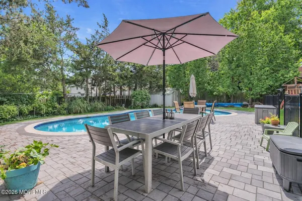 a patio with a patio table and chairs