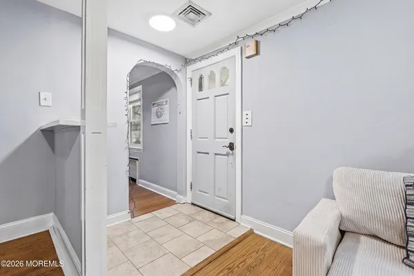 a view of livingroom with hardwood floor and hallway