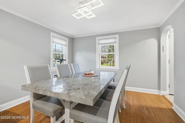 a view of a dining room with furniture window and wooden floor