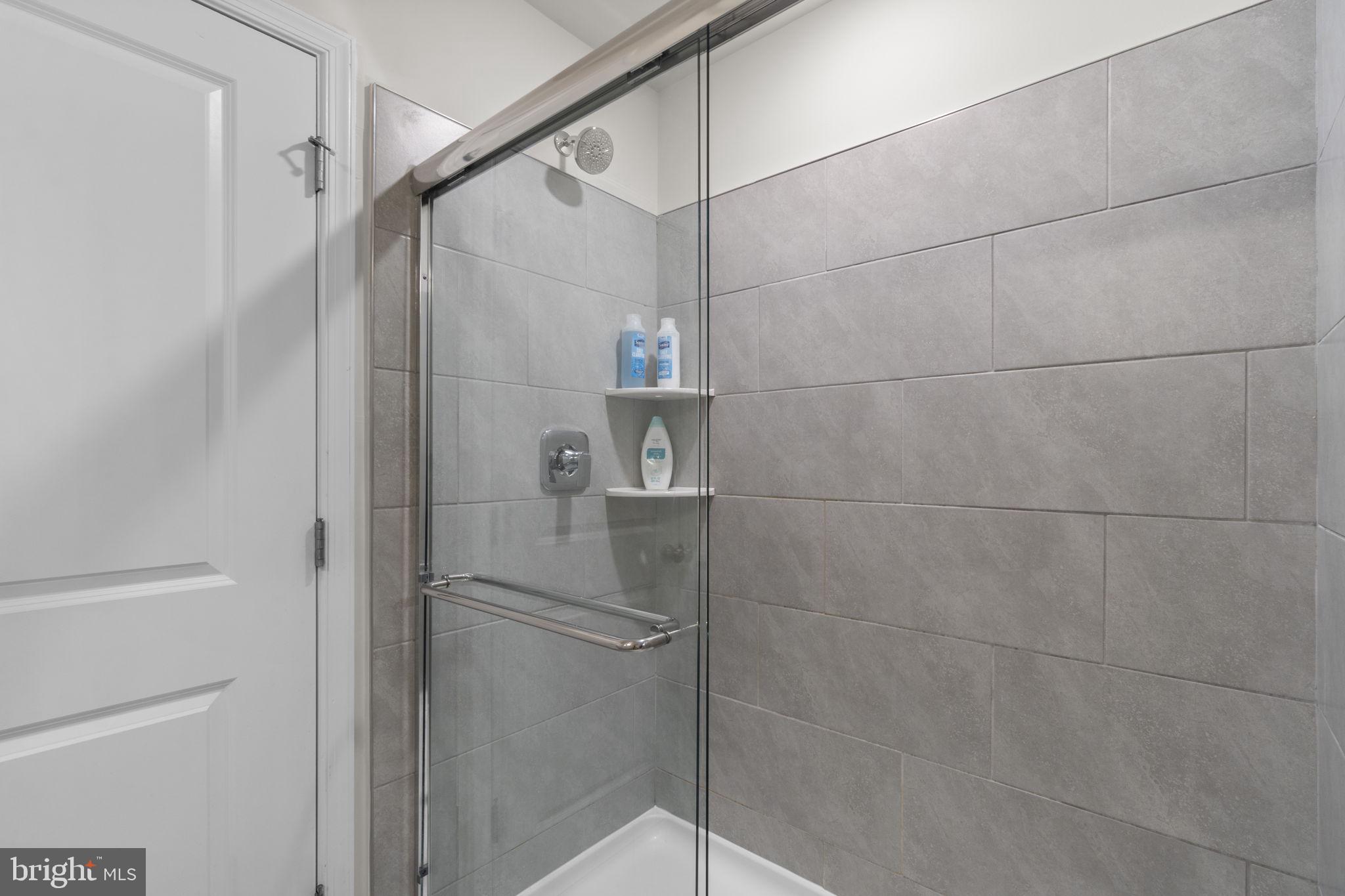 417 Union Street Frederick, MD 21701 - Photo 20 of 35 Sleek modern shower with elegant tiles.
