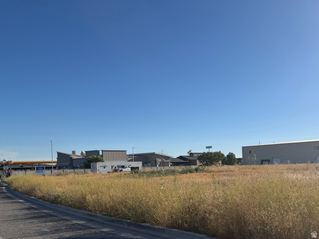 2709 North Rulon White Boulevard Ogden, UT 84404 - Photo 2 of 4 Expansive undeveloped land featuring natural grasses and a clear sky backdrop