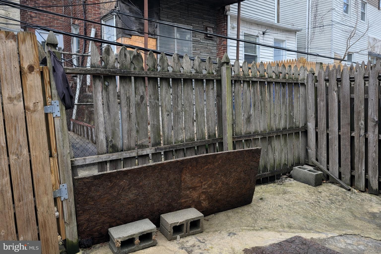 4548 North 17th Street Philadelphia, PA 19140 - Photo 13 of 13 a backyard of a house with chairs