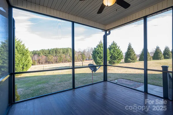 a view of an entryway with wooden floor