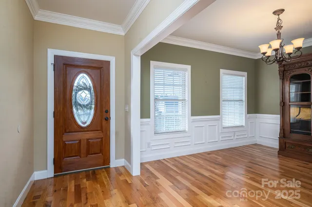 a view of an entryway with wooden floor