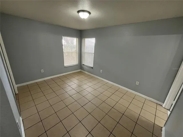 a view of an empty room and window