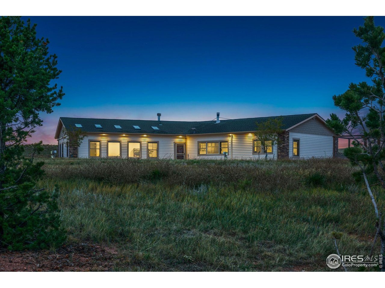202 Roundtree Road Livermore, CO 80536 - Photo 47 of 50 Large back patio facing the mountains - the perfect spot for morning coffee, sunset happy hour, and stargazing
