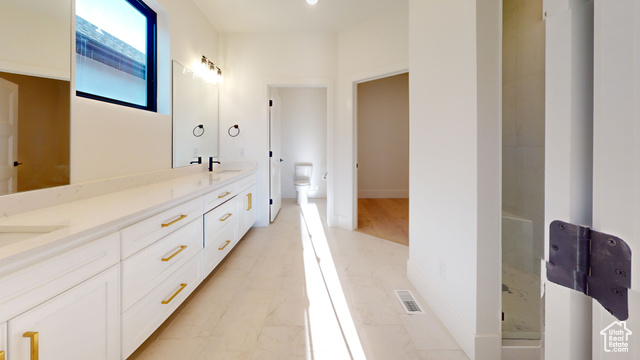 683 North Heritage Street Mapleton, UT 84664 - Photo 21 of 40 Full bathroom with double vanity and marble look tile flooring