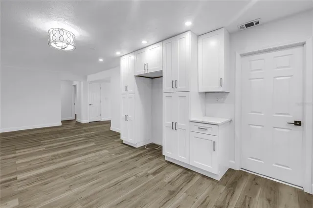 a view of a kitchen with a sink and a stove top oven