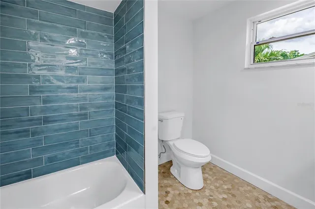 a backyard of a house with seating space