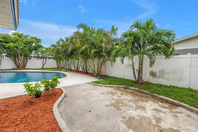 a view of a swimming pool with a yard