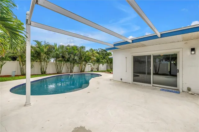 a view of house with a big yard