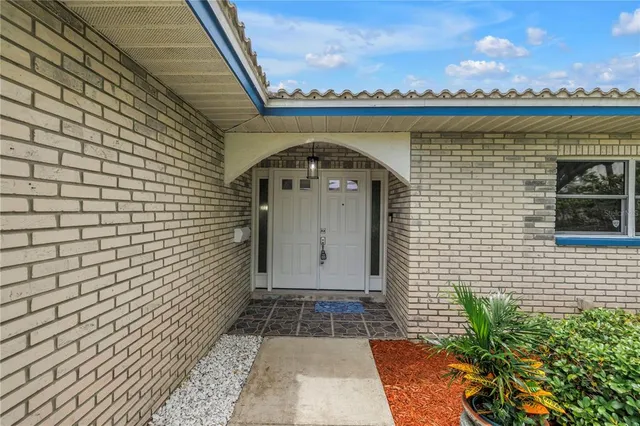 a view of a kitchen with a sink and wooden floor