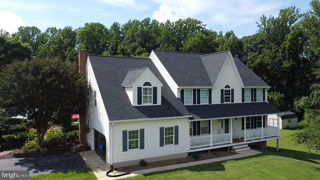 a aerial view of a house with a yard