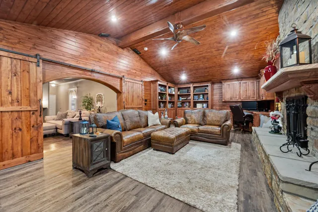 a living room with lots of furniture and a chandelier