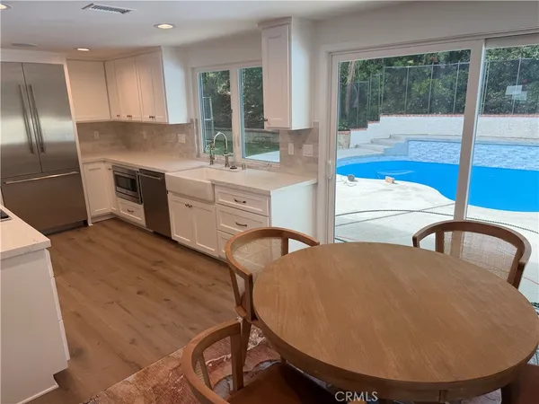a very nice looking kitchen with a large window