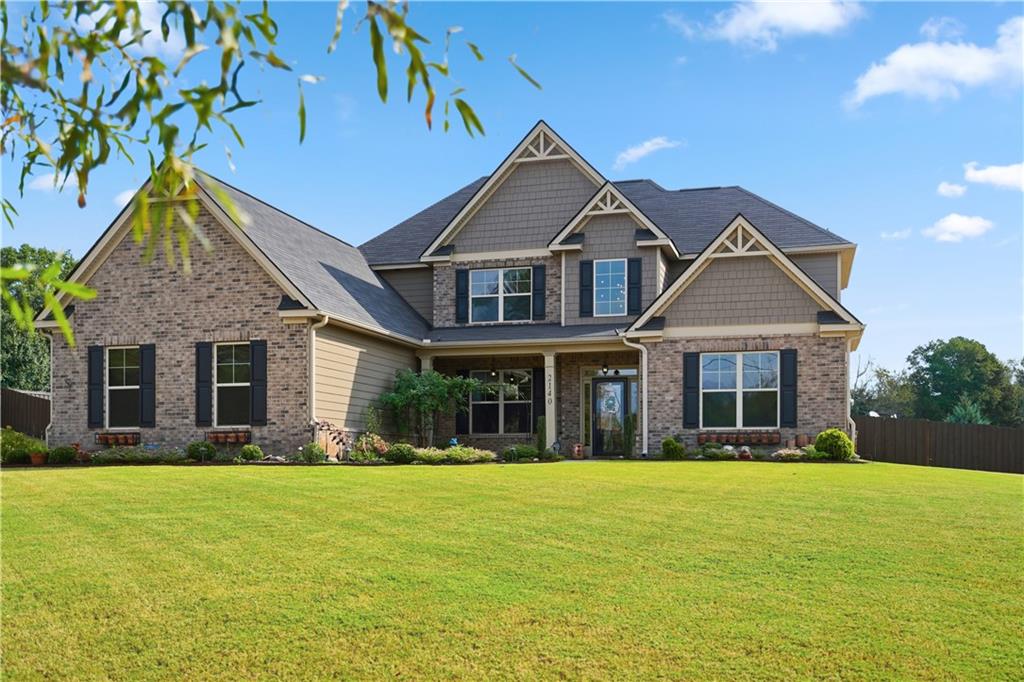 a front view of a house with a yard