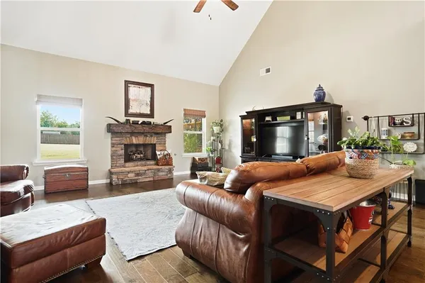 a living room with furniture and a fireplace