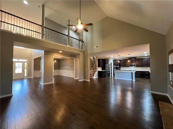 a view of an entryway with dining room and wooden floor