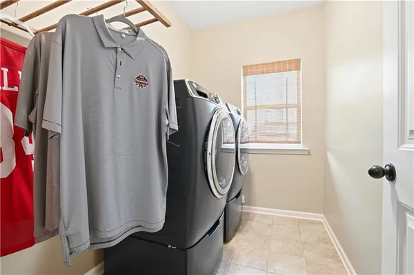 a bathroom with a granite countertop shower and a sink