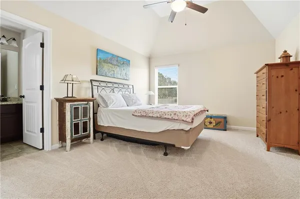 a view of a livingroom with furniture and a flat screen tv