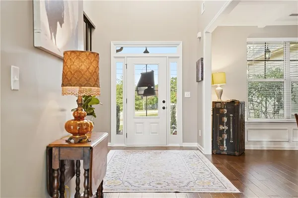 a living room with a baby crib furniture and a window
