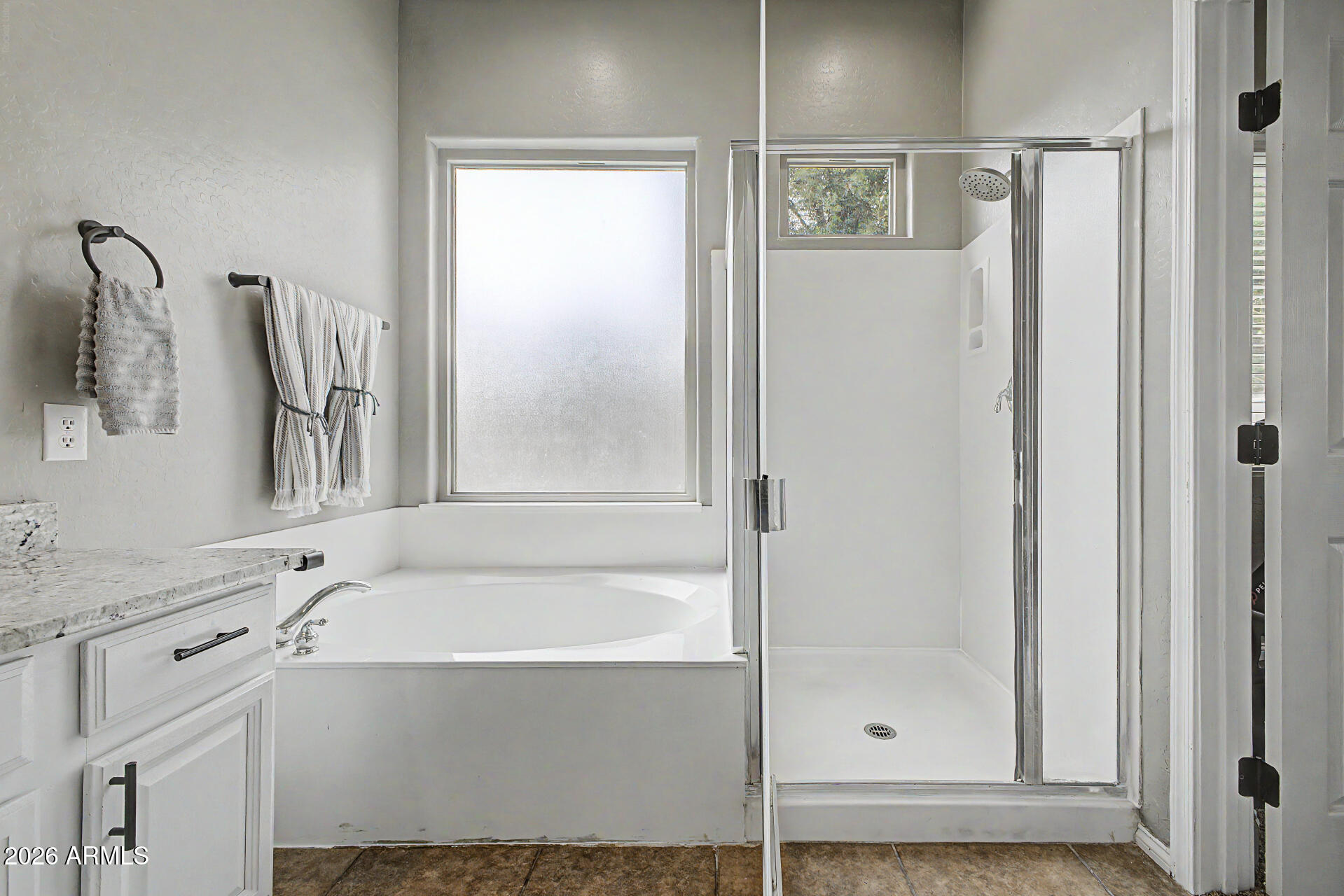 4272 East Buckboard Road Gilbert, AZ 85297 - Photo 22 of 37 a bathroom with a bathtub and a shower
