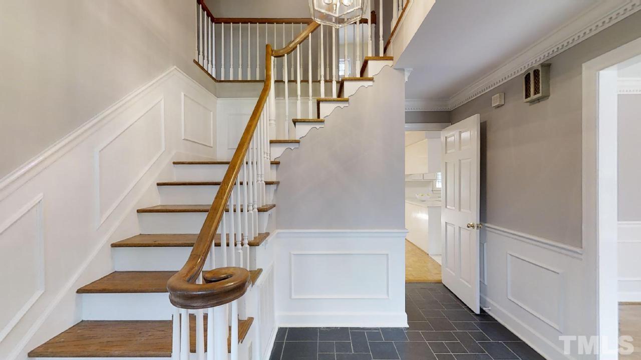 6709 Foxfire Place Raleigh, NC 27615 - Photo 2 of 24 a view of entryway and hall with wooden floor