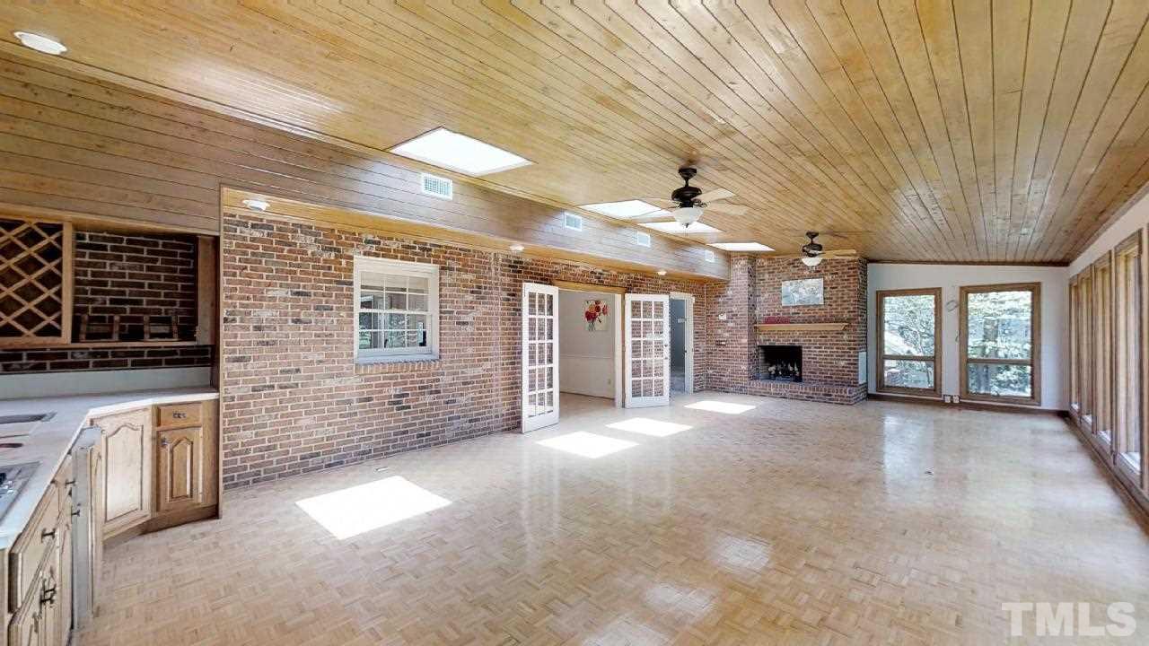 6709 Foxfire Place Raleigh, NC 27615 - Photo 13 of 24 a view of an empty room with a fireplace