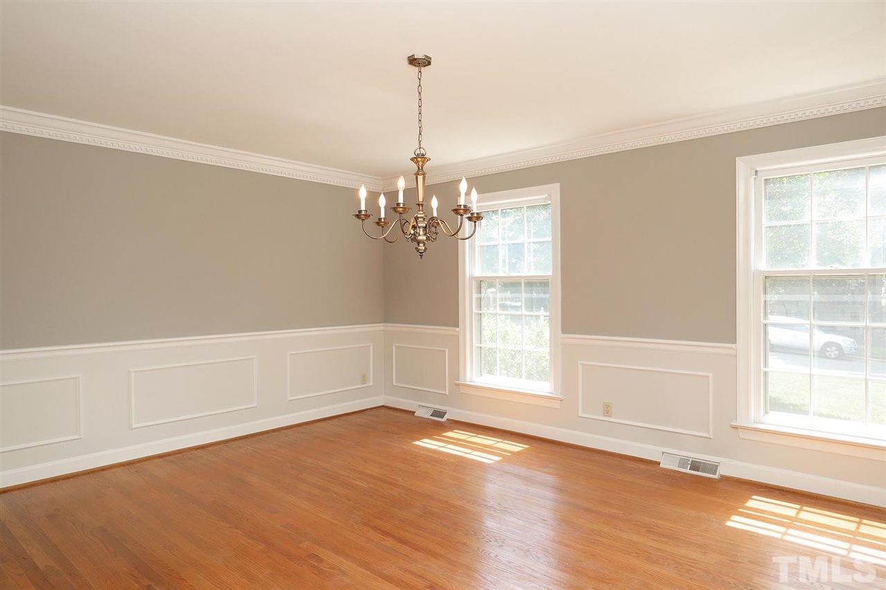 6709 Foxfire Place Raleigh, NC 27615 - Photo 14 of 24 a view of empty room with wooden floor and fan