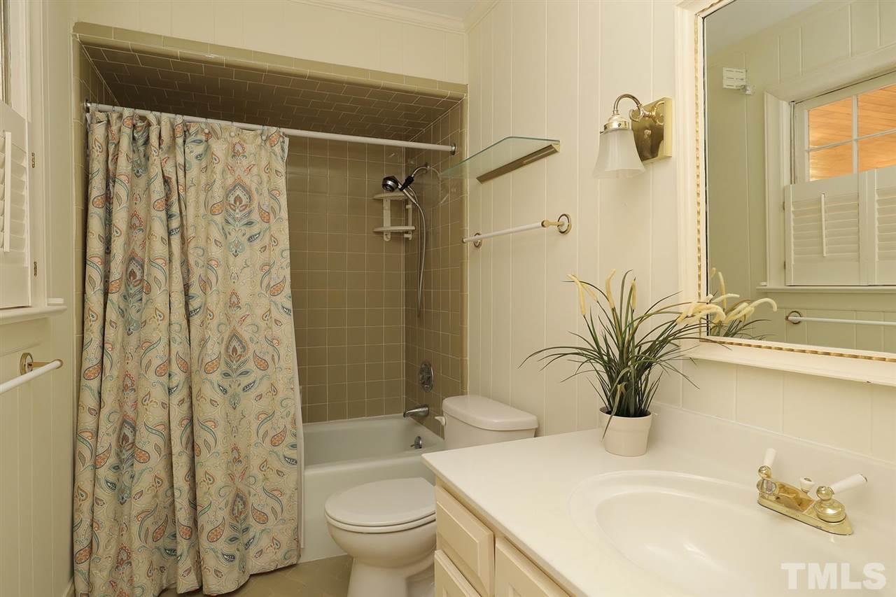 6709 Foxfire Place Raleigh, NC 27615 - Photo 15 of 24 a bathroom with a sink toilet and shower