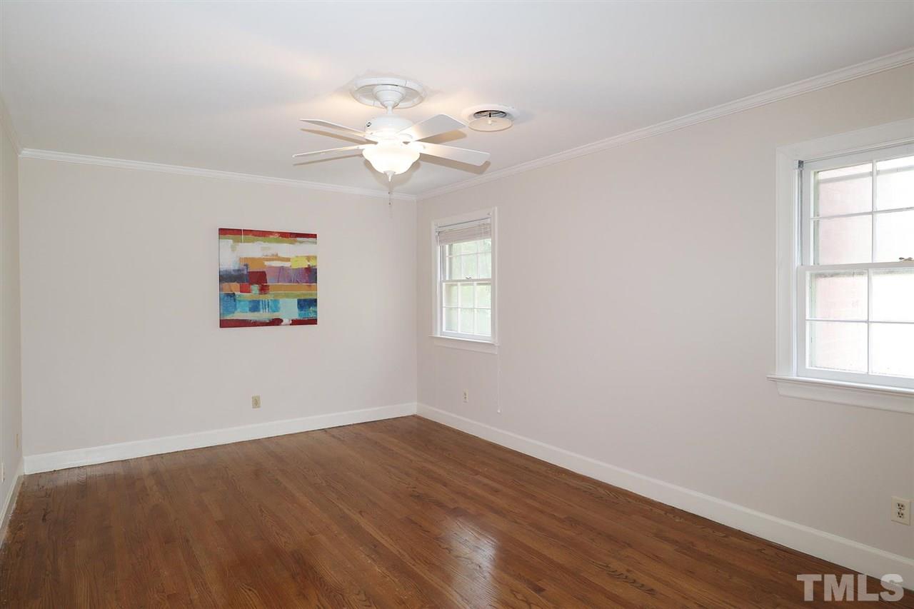6709 Foxfire Place Raleigh, NC 27615 - Photo 17 of 24 a view of a room with wooden floor and window