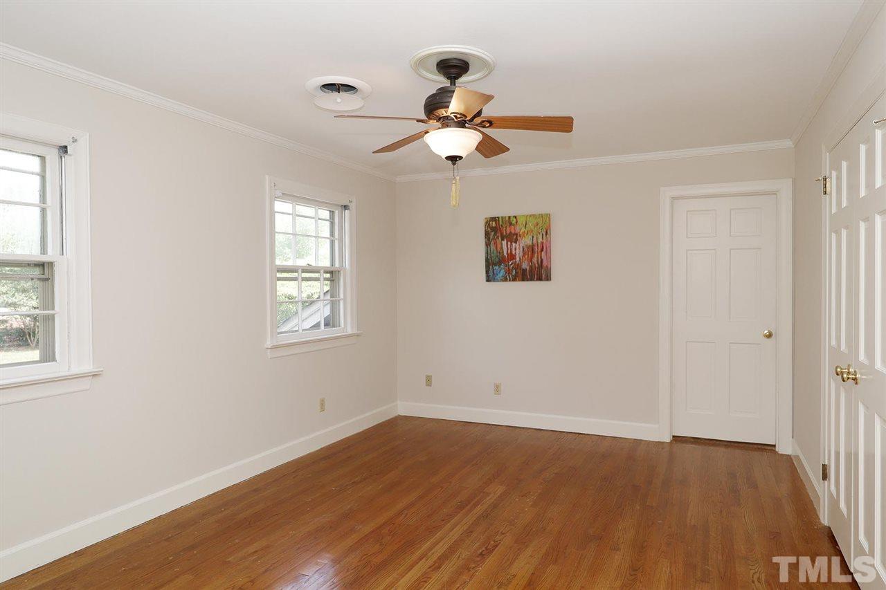 6709 Foxfire Place Raleigh, NC 27615 - Photo 19 of 24 wooden floor in an empty room with a window