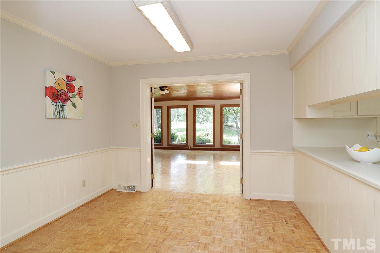 6709 Foxfire Place Raleigh, NC 27615 - Photo 7 of 24 wooden floor in an empty room with a window