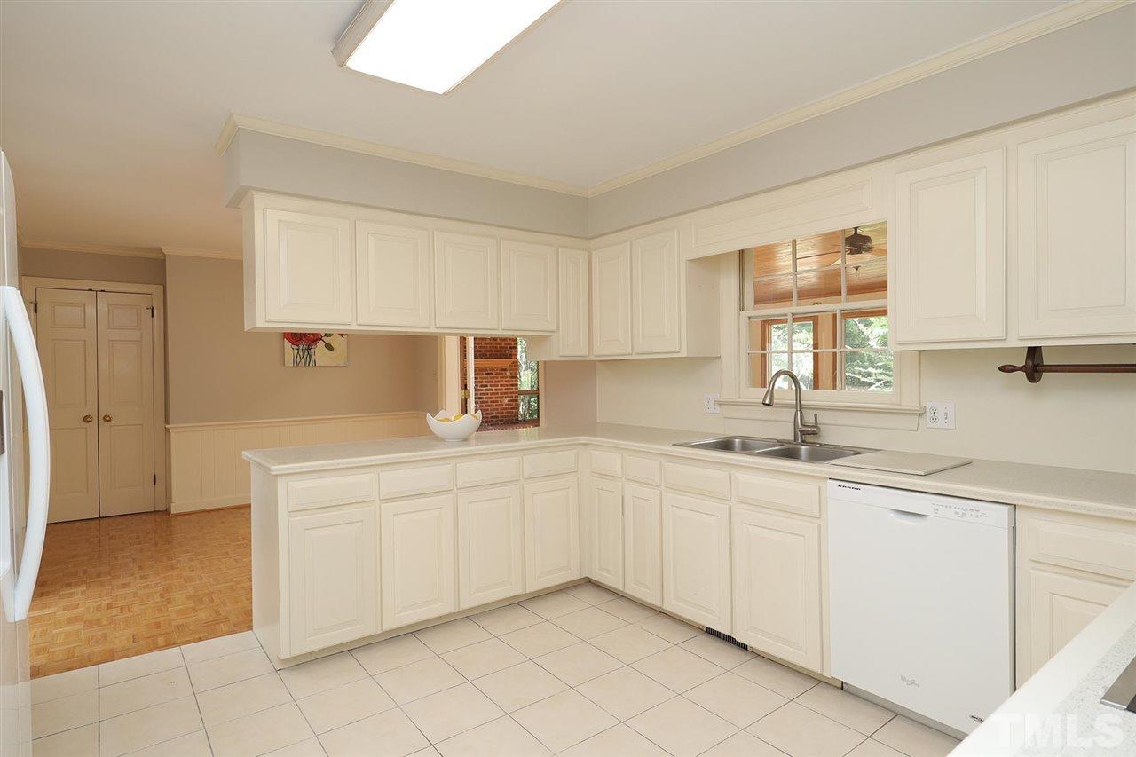 6709 Foxfire Place Raleigh, NC 27615 - Photo 9 of 24 a kitchen with a sink and cabinets