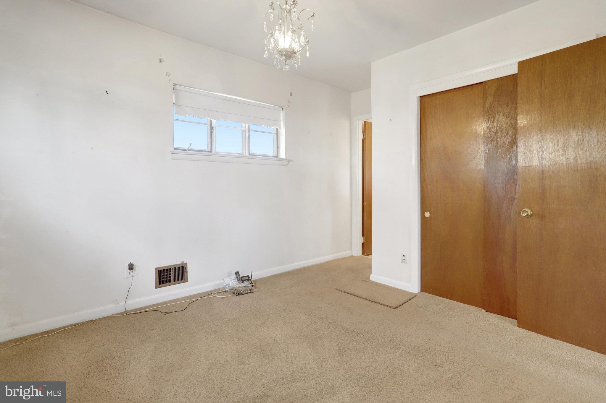 6928 Ruskin Street Springfield, VA 22150 - Photo 12 of 34 an empty room with windows and closet
