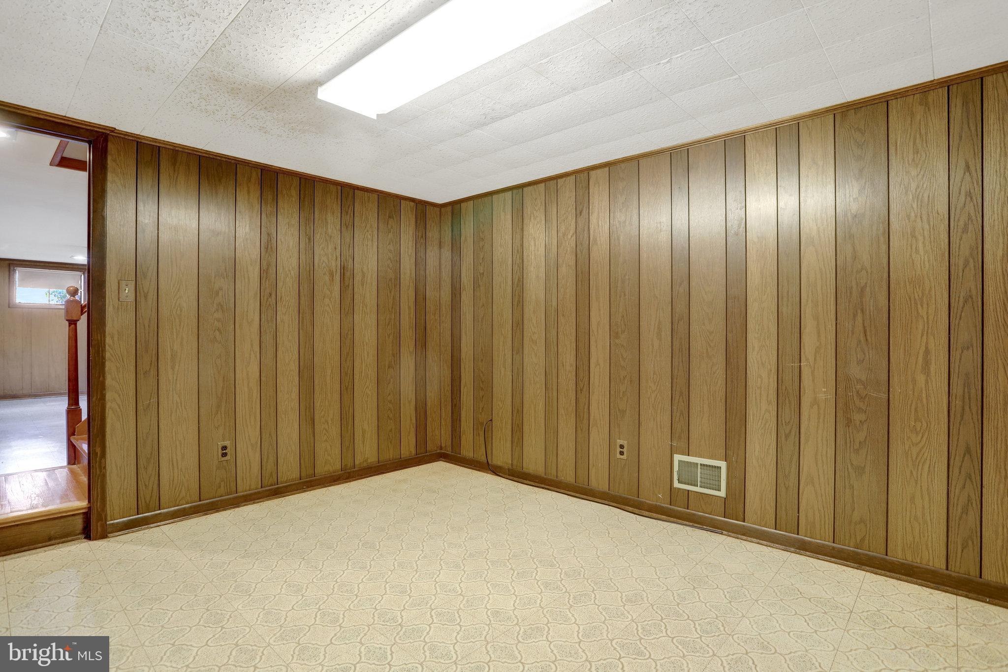 6928 Ruskin Street Springfield, VA 22150 - Photo 21 of 34 a view of an empty room with wooden walls