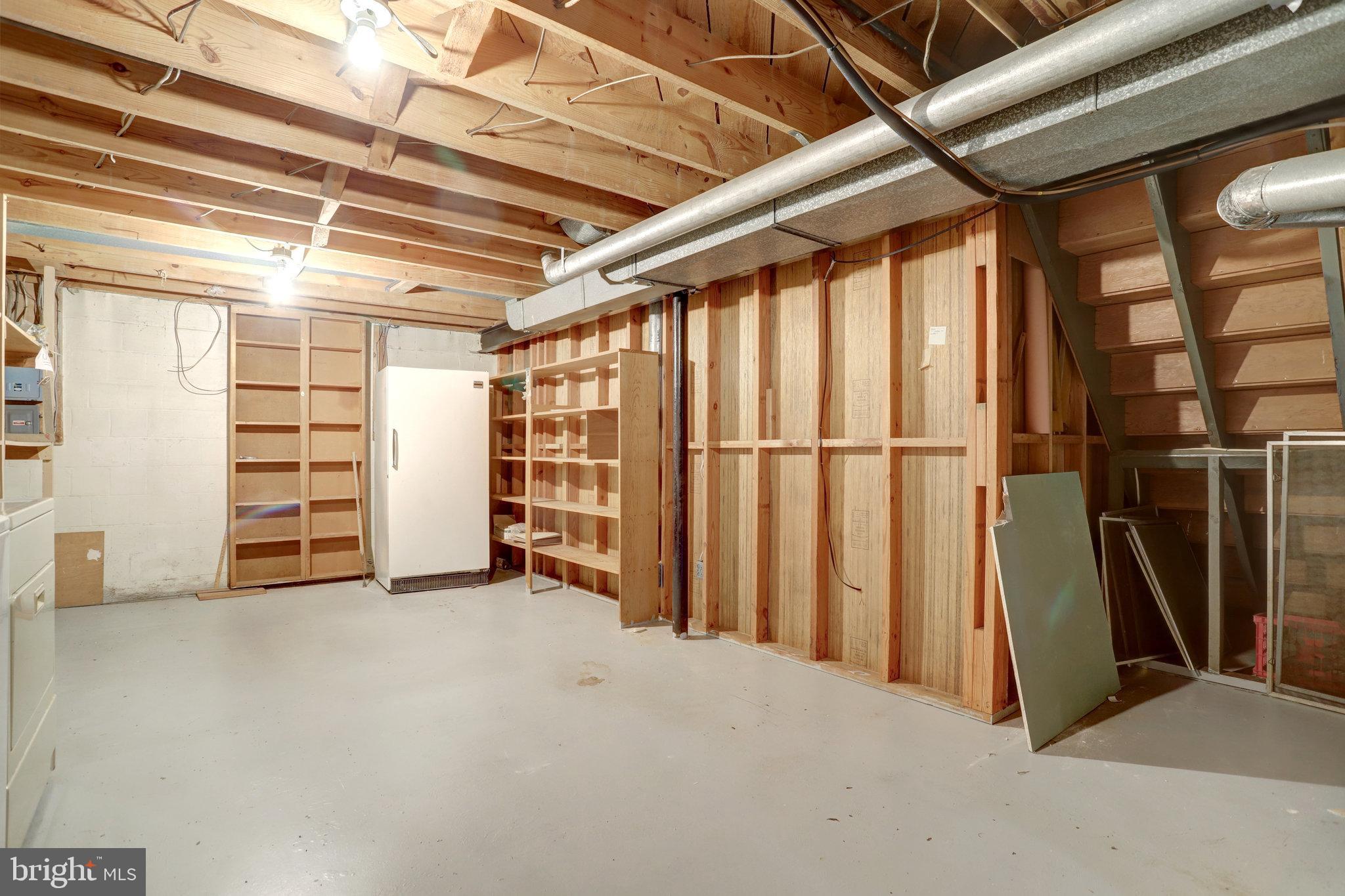 6928 Ruskin Street Springfield, VA 22150 - Photo 28 of 34 a view of an empty room with stairs