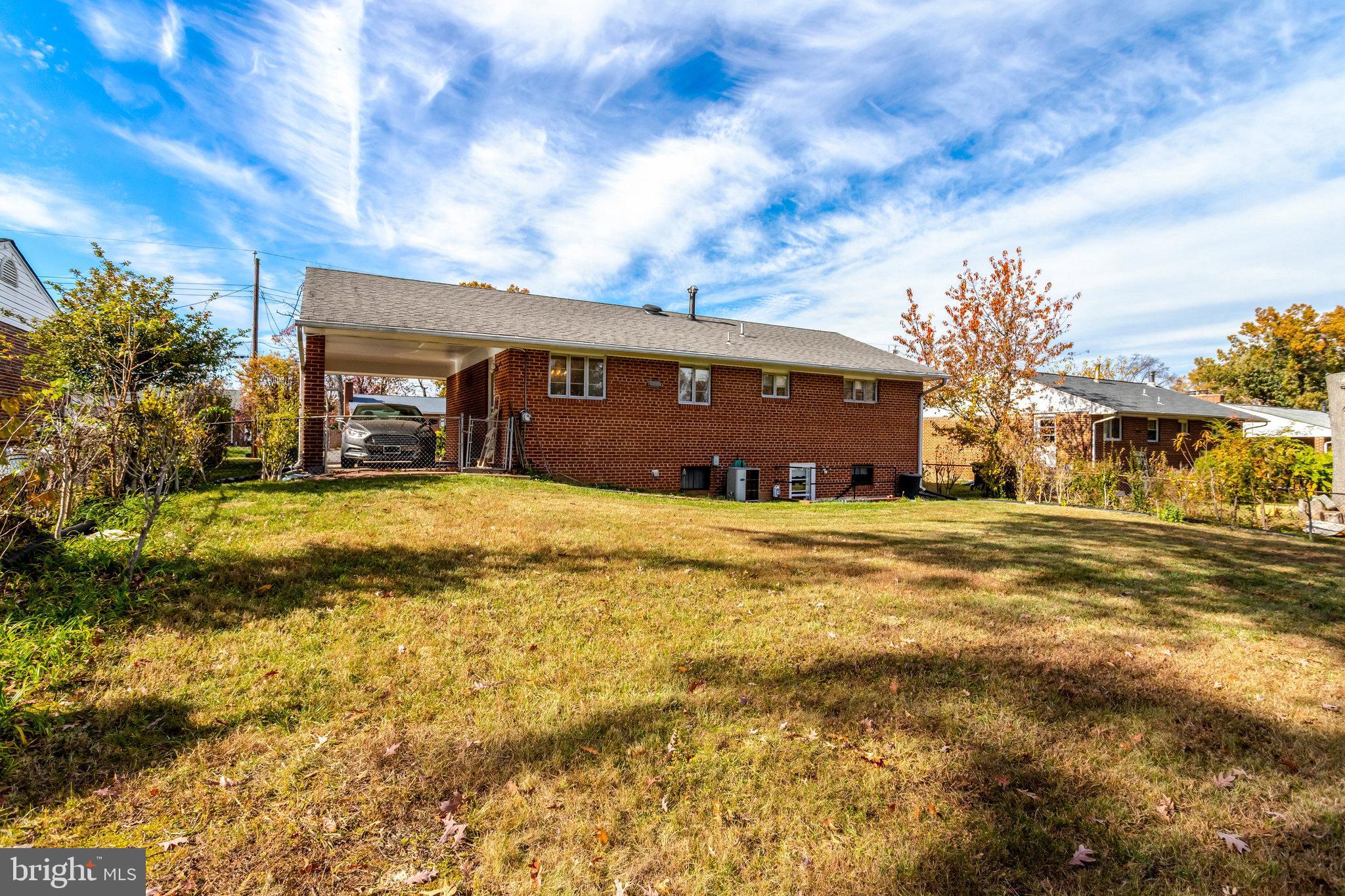 6928 Ruskin Street Springfield, VA 22150 - Photo 31 of 34 a view of a house with a yard