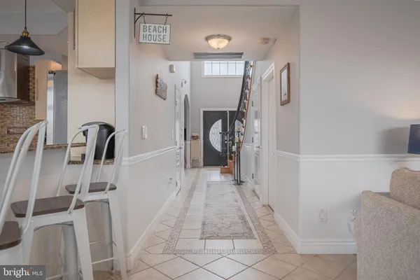 a kitchen with stainless steel appliances kitchen island granite countertop a table and chairs in it