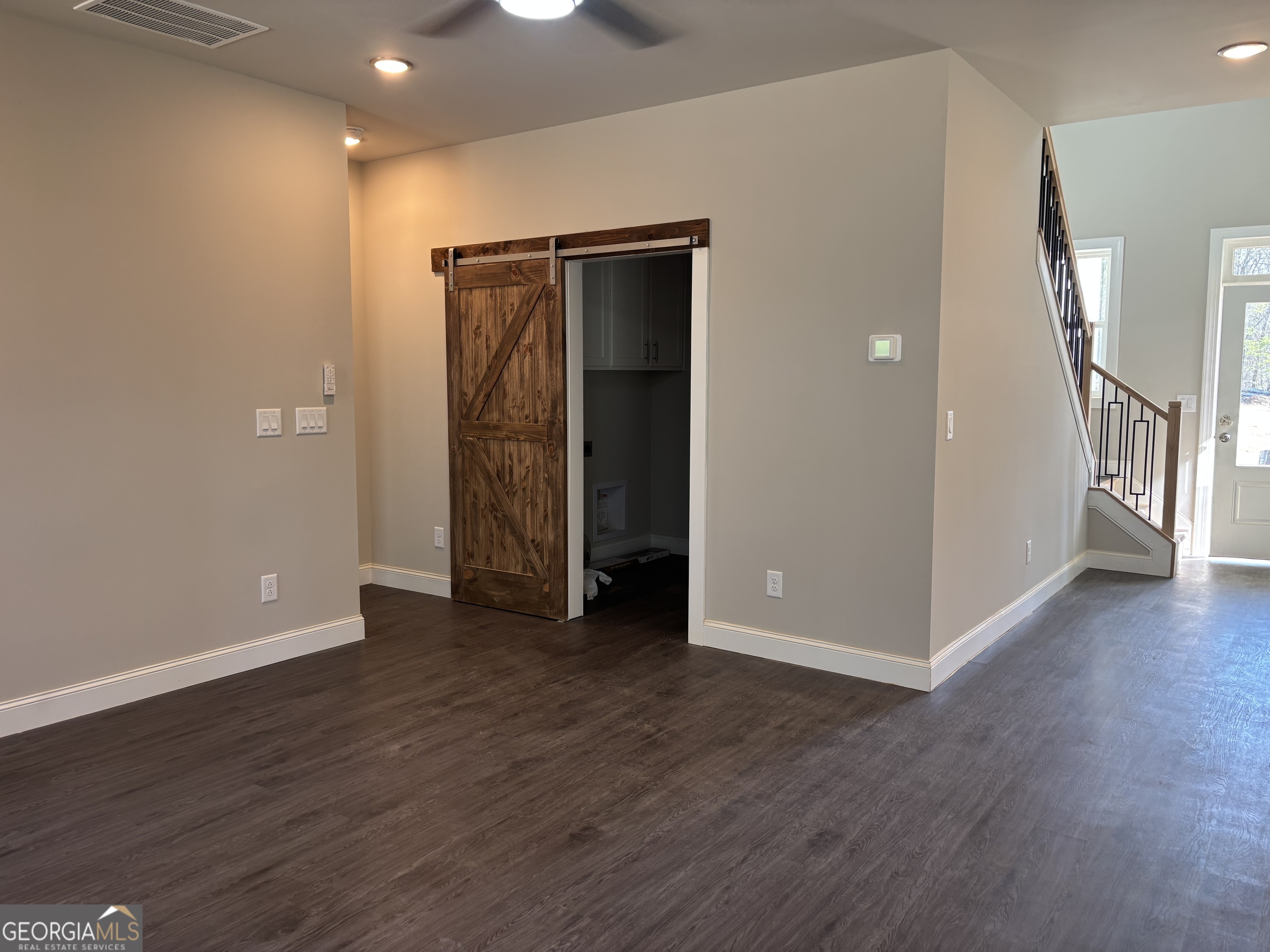 16 Hadrian Ridge Drive Southwest Rome, GA 30165 - Photo 18 of 25 an empty room with wooden floor and a window