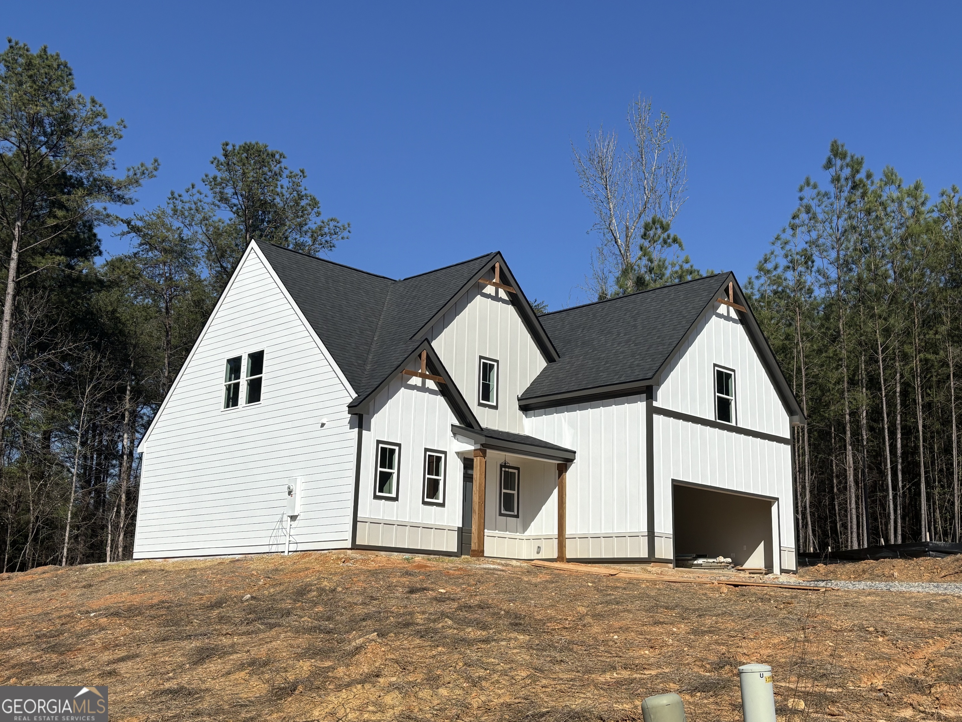 16 Hadrian Ridge Drive Southwest Rome, GA 30165 - Photo 7 of 25 a front view of a house with a yard and garage
