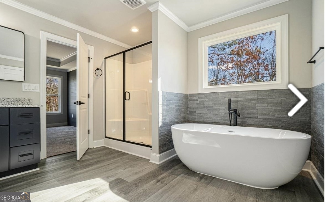 16 Hadrian Ridge Drive Southwest Rome, GA 30165 - Photo 9 of 25 a spacious bathroom with a bathtub and shower