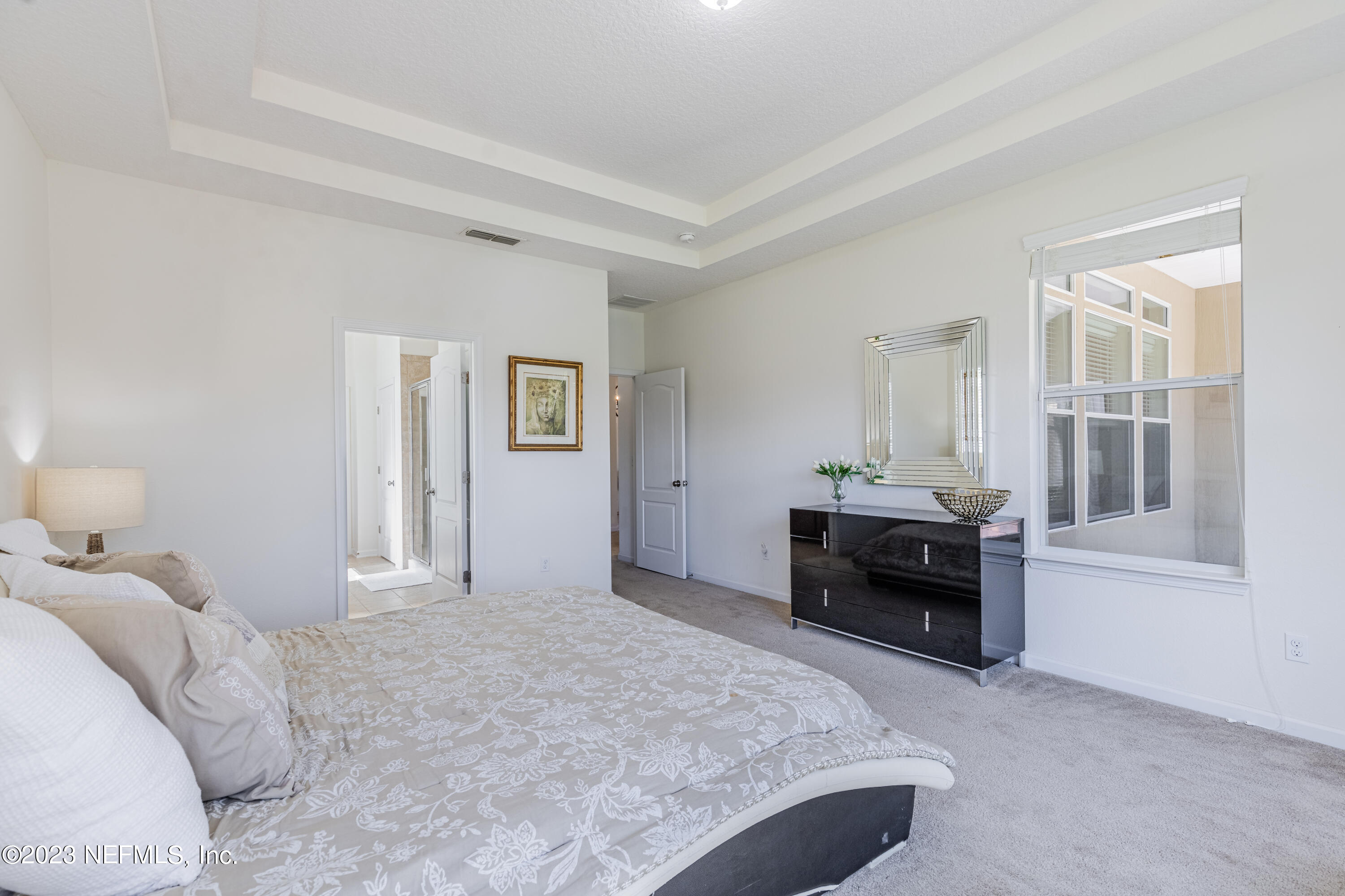 800 Eagle Cove Drive Fleming Island, FL 32003 - Photo 13 of 99 a bedroom with a bed and a window