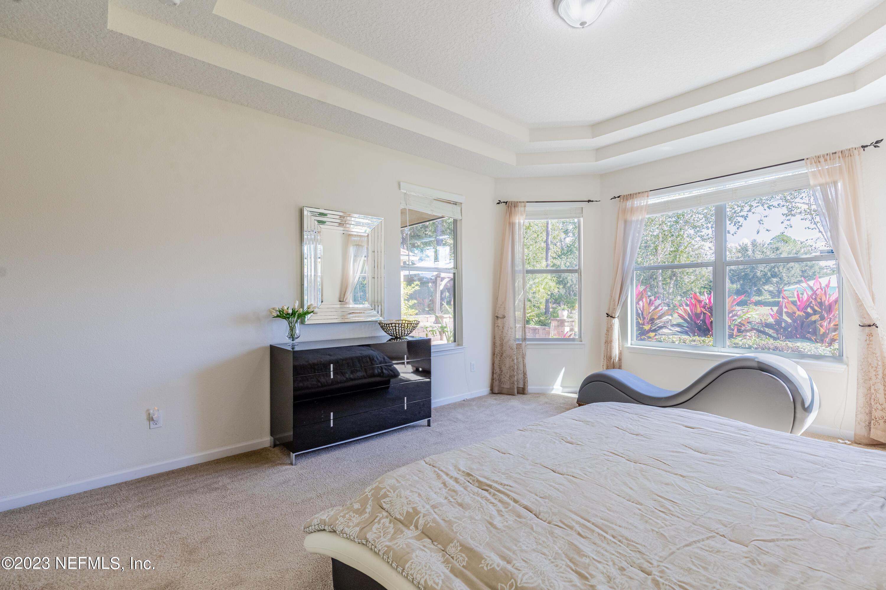 800 Eagle Cove Drive Fleming Island, FL 32003 - Photo 14 of 99 a bedroom with a bed and a large window