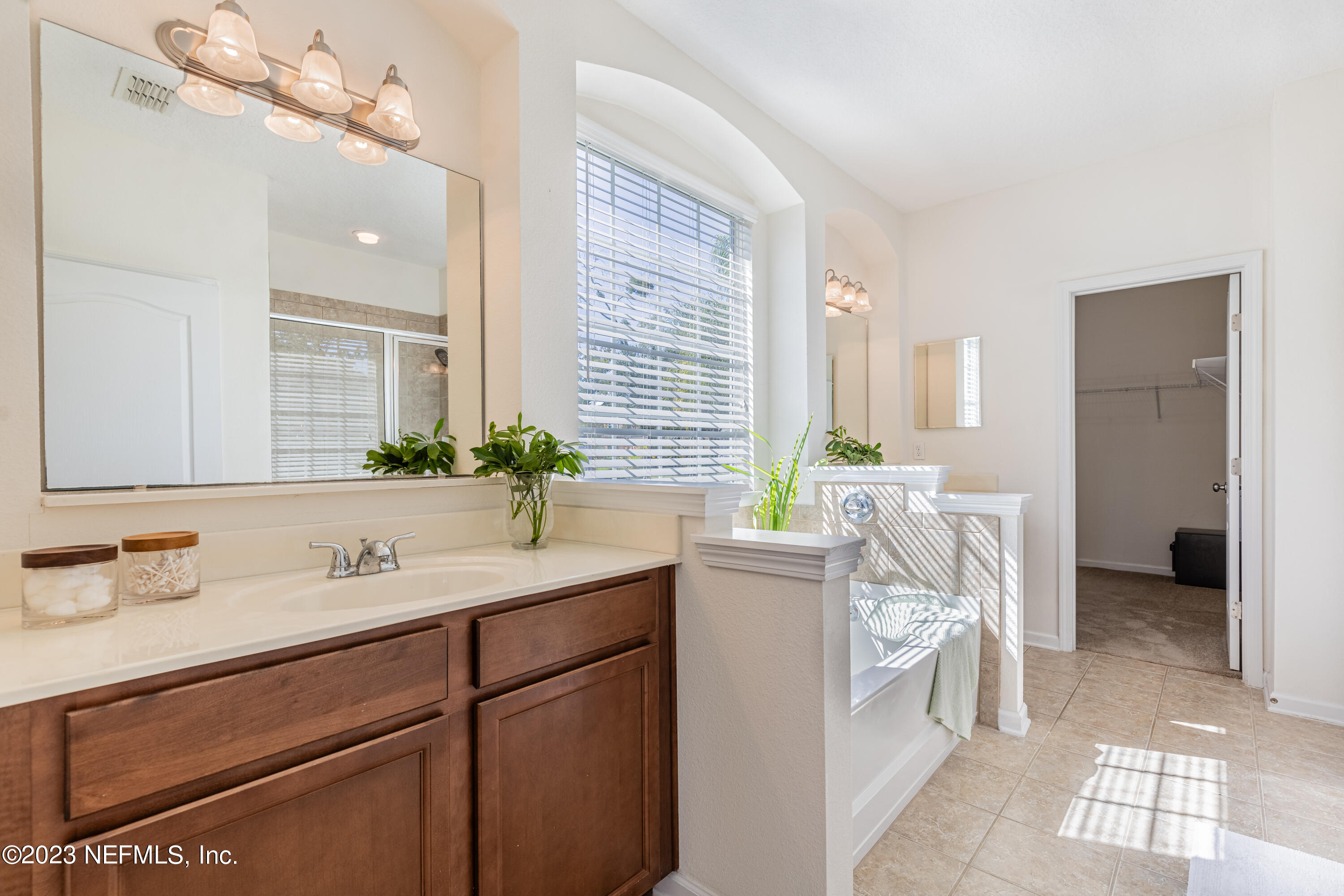 800 Eagle Cove Drive Fleming Island, FL 32003 - Photo 15 of 99 a bathroom with a granite countertop sink a toilet and mirror