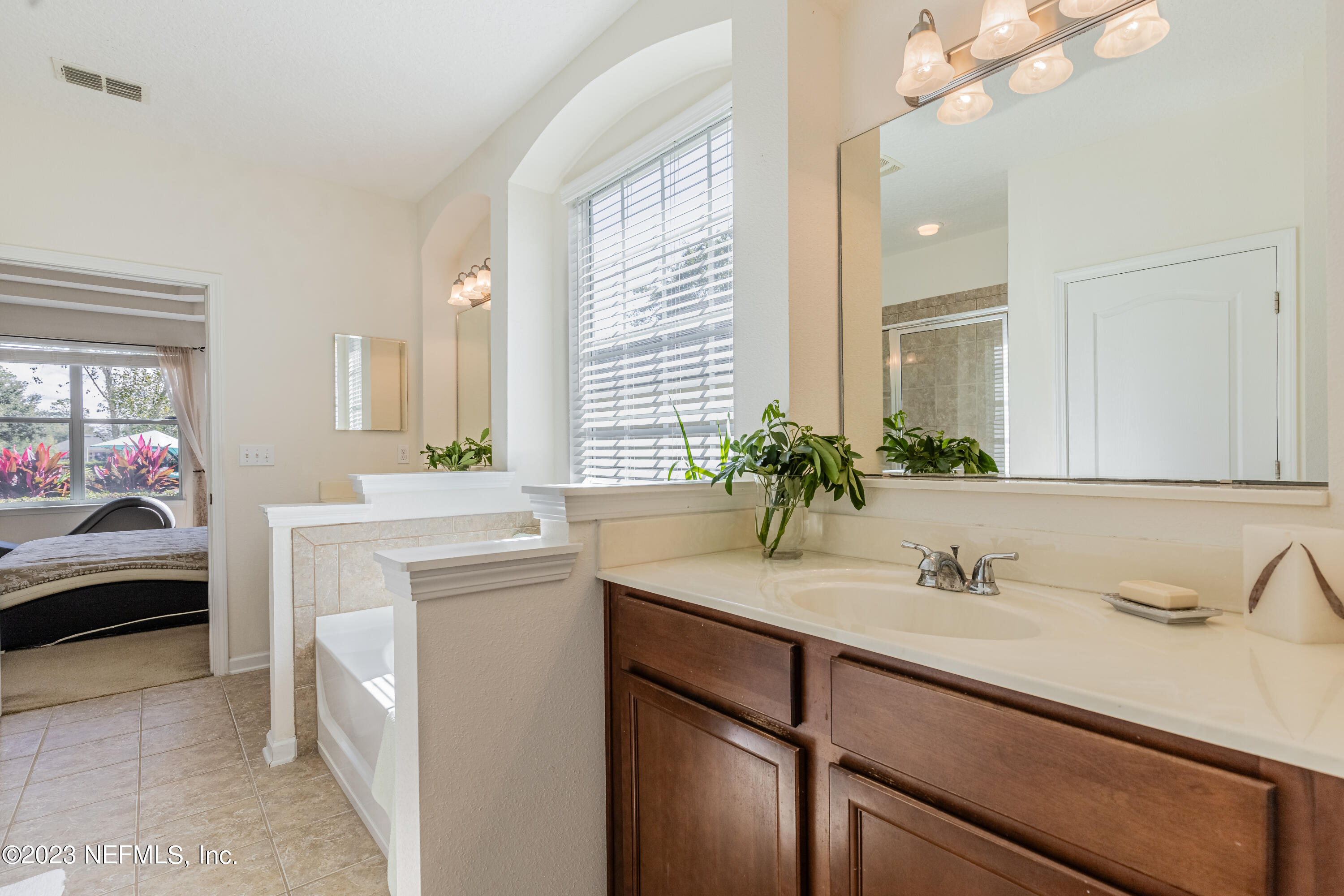 800 Eagle Cove Drive Fleming Island, FL 32003 - Photo 17 of 99 a bathroom with a sink and a mirror