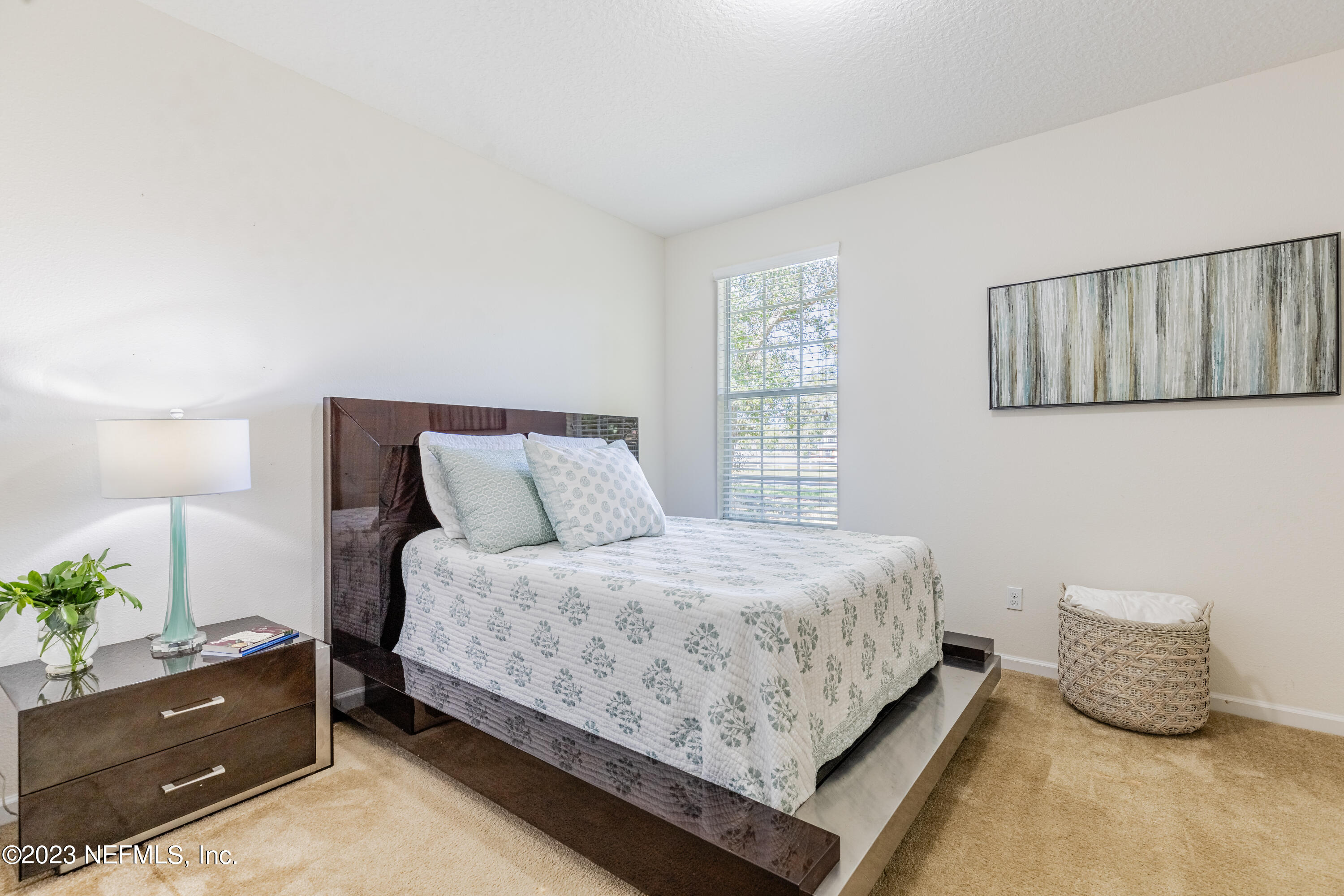 800 Eagle Cove Drive Fleming Island, FL 32003 - Photo 21 of 99 a bedroom with a bed and window